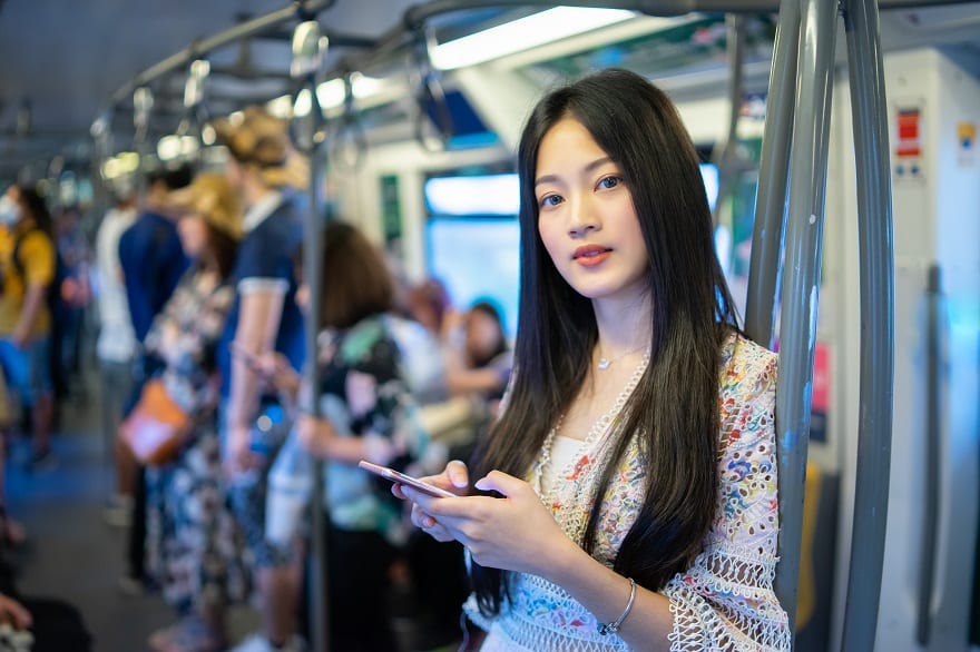 young Asian woman travelling by the train or Mass Rapid Transit(MRT)